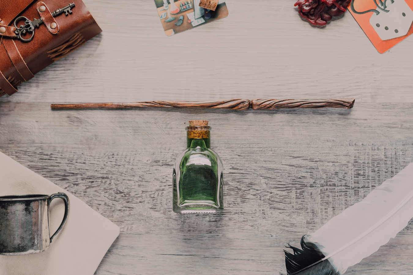 Close-Up Shot of a Wand beside a Potion